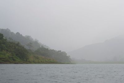 Scenic view of sea against sky during foggy weather