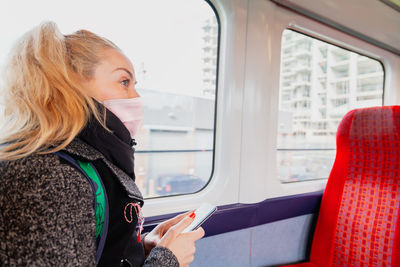 Beautiful woman sitting in train