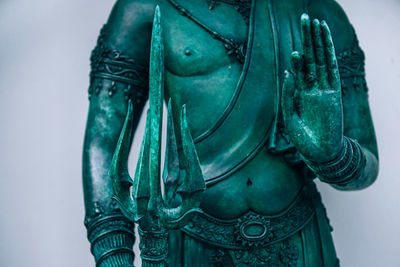 Close-up of statue against gray background