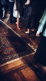 Low section of woman standing on ground