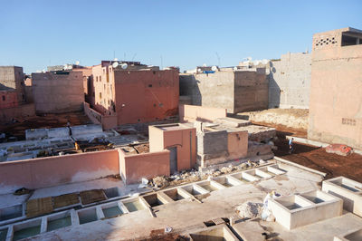 High angle view of residential buildings against clear blue sky