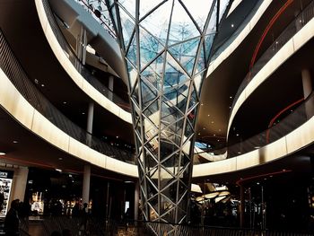 Low angle view of illuminated shopping mall