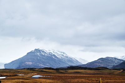 Scenic view of snowcapped mountains against sky