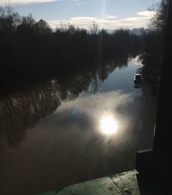 Scenic view of lake against sky during sunset