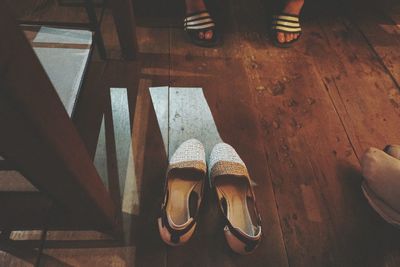 High angle view of shoes on hardwood floor