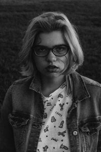 Portrait of beautiful young woman standing outdoors