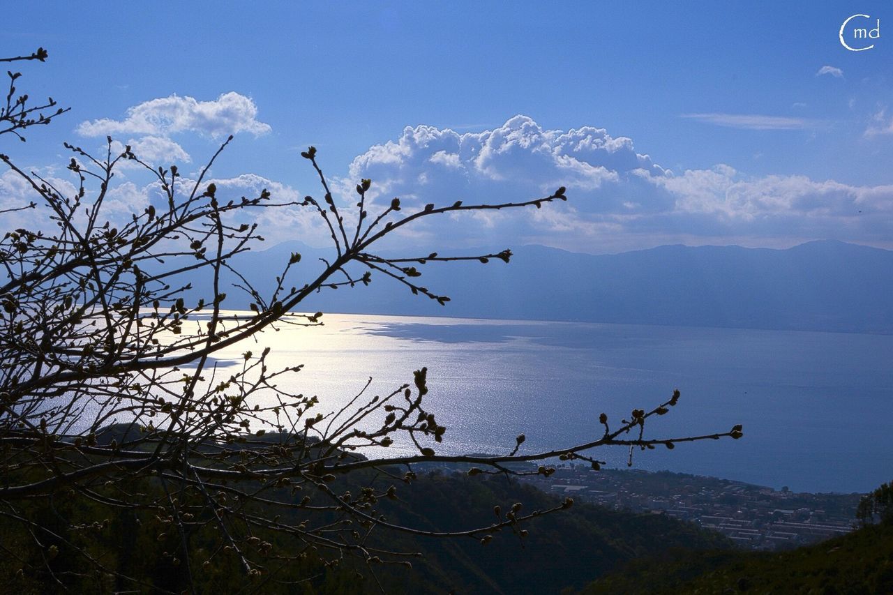 tranquility, tranquil scene, sky, scenics, beauty in nature, nature, plant, mountain, water, landscape, branch, blue, growth, bare tree, lake, dead plant, idyllic, non-urban scene, cloud, mountain range