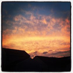 Low angle view of cloudy sky at sunset