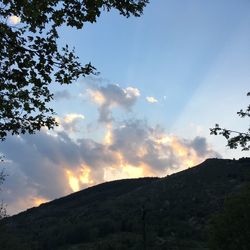 Low angle view of silhouette mountain against sky during sunset