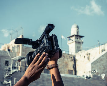 Man photographing through camera