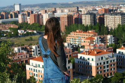 Woman looking at cityscape
