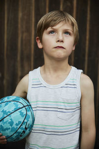 Portrait of boy holding ball