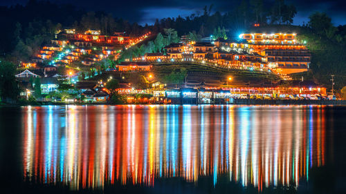 Illuminated buildings in city at night