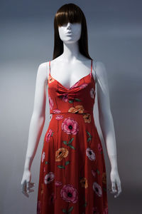 Dress on mannequin against wall