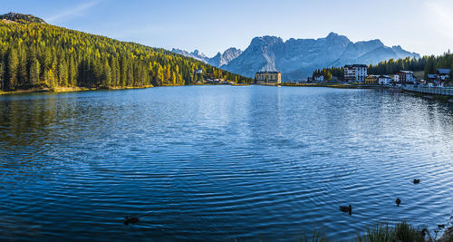 Scenic view of lake and mountains against sky