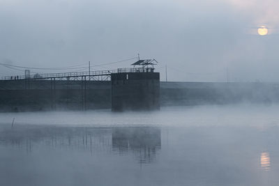 Bridge over lake against sky