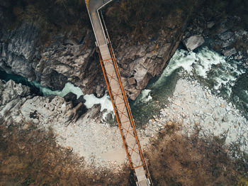 Directly above shot of footbridge over river