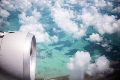 Aerial view of cloudscape seen from airplane window