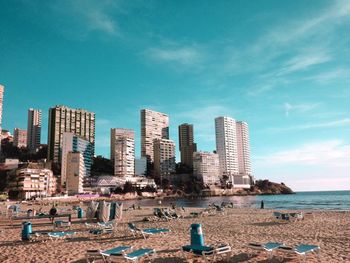 View of beach with city in background