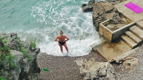 Woman standing on rocks