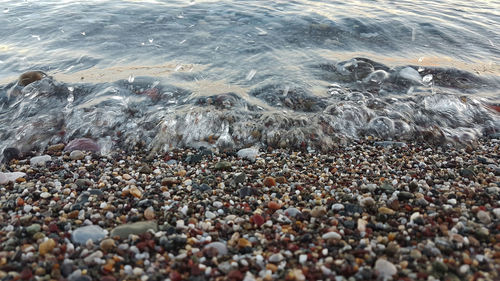 High angle view of pebbles on beach