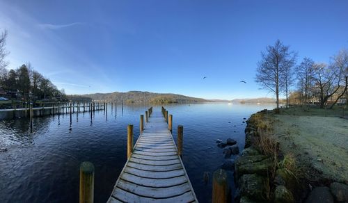 Panoramic view of pier on lake against sky