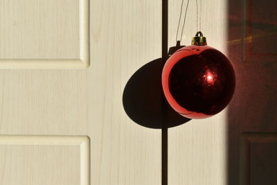 Close-up of christmas decoration hanging on door