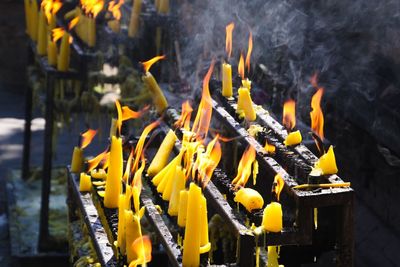 Close-up of yellow fire in temple
