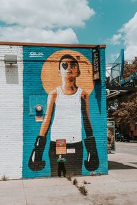 Full length of man standing by built structure against sky