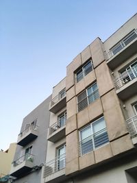 Low angle view of buildings against clear sky