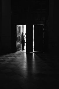 Man standing at doorway