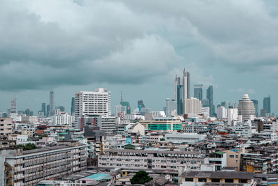 High angle view of modern buildings in city against sky