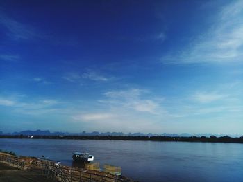 Scenic view of sea against blue sky