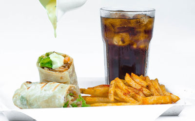 Close-up of food on table against white background