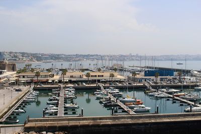 High angle view of boats moored at harbor