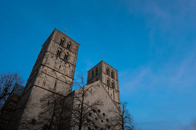 Low angle view of building against clear blue sky