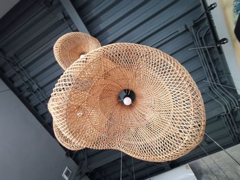 Low angle view of hat hanging on ceiling