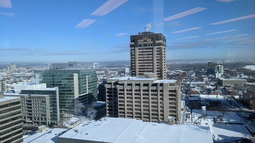 Modern buildings in city against sky