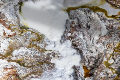 High angle view of rocks in sea