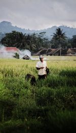 Scenic view of agricultural field against sky