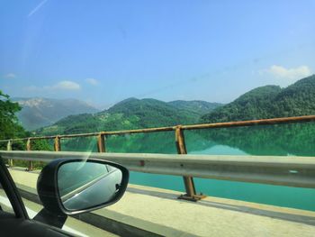 Scenic view of mountains against blue sky