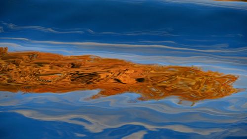 High angle view of reflection in lake against sky