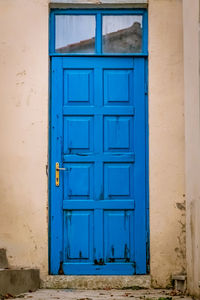 Closed blue door of building