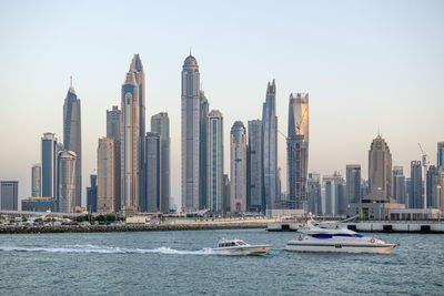 Amazing dubai marina and famous jumeirah beach at sunset, united arab emirates