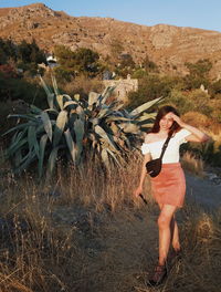 Full length of woman standing on ground