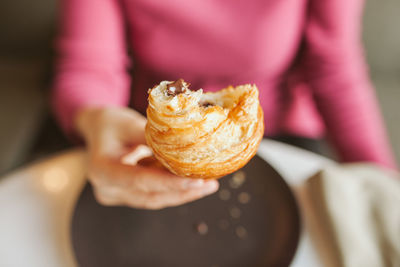 Midsection of woman holding ice cream