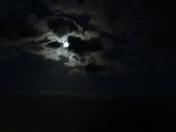 Low angle view of moon in sky at night