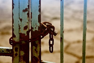 Close-up of padlock on metal fence