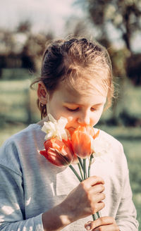 Girl holding flower