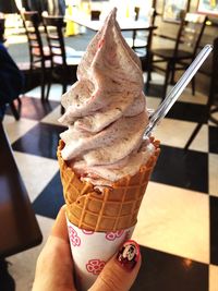 Cropped image of woman holding ice cream cone